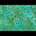 A close-up of a batik fabric pattern featuring vibrant turquoise blue and green tropical floral motifs with white outlines.
