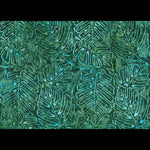 A close-up of a batik fabric pattern featuring stylized tropical leaf motifs in shades of green and turquoise blue.