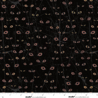 Black fabric with floating eye pattern