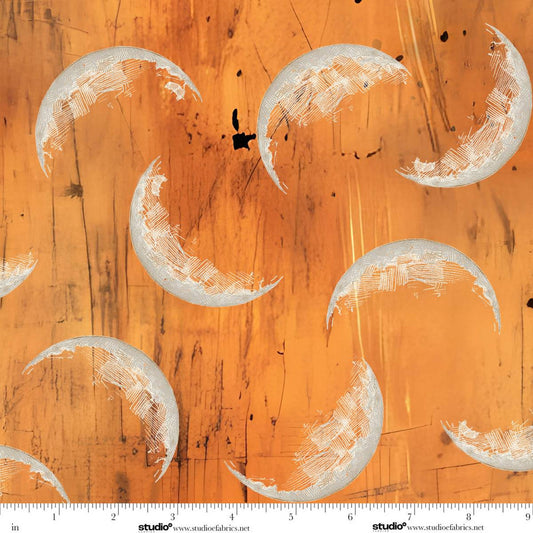 Pattern of crescent moons on an orange background.