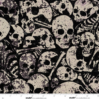 Pattern of skulls and bones on a black background