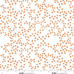 White fabric with a repeating pattern of small orange duck foot prints, shown with a ruler along the bottom edge for scale.