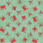 A repeating pattern of red gift bows with small gold bells on a light mint green background.