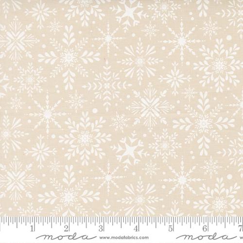 Beige fabric with white snowflake pattern.