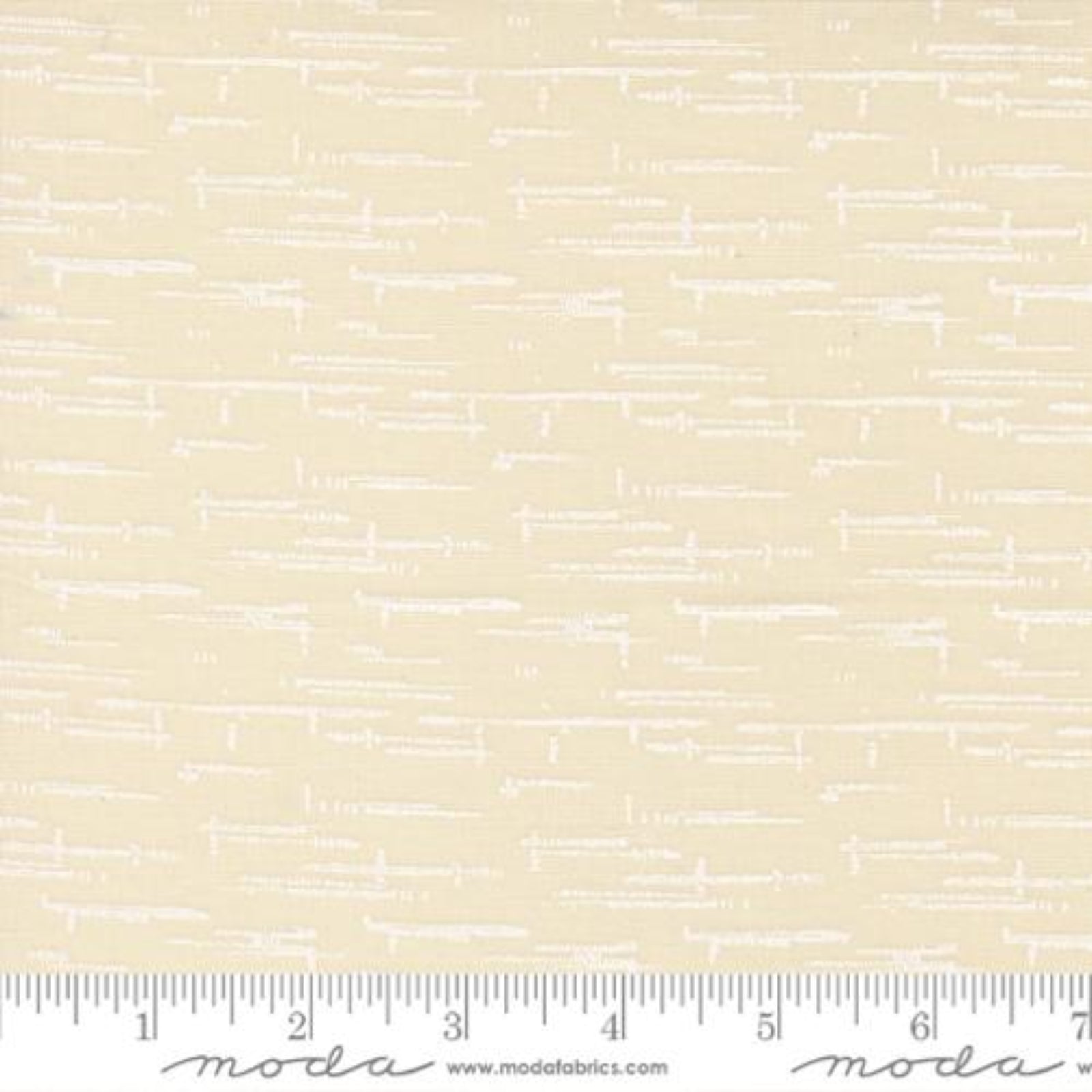 A close-up of a fabric pattern featuring a light cream background with a repeating white hand-drawn line design, with a ruler at the bottom showing the scale.