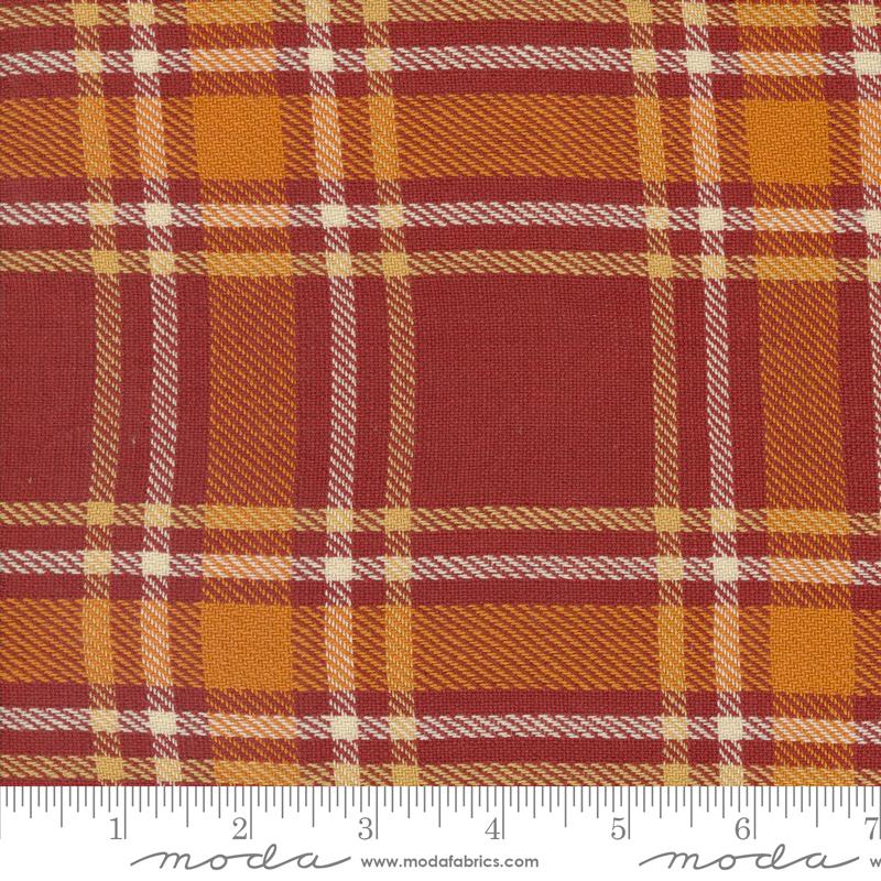 Woven plaid fabric pattern with red and orange colors.
