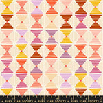 Colorful geometric pattern fabric with a ruler at the bottom, featuring colors like pink, orange, yellow, and purple on a beige background. Brand 'Ruby Star Society' is visible.
