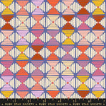 Patterned fabric with geometric design in multicolors on a purple background, featuring Ruby Star Society label.