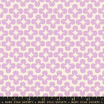 Patterned fabric with purple geometric shapes on a beige background, featuring Ruby Star Society label.
