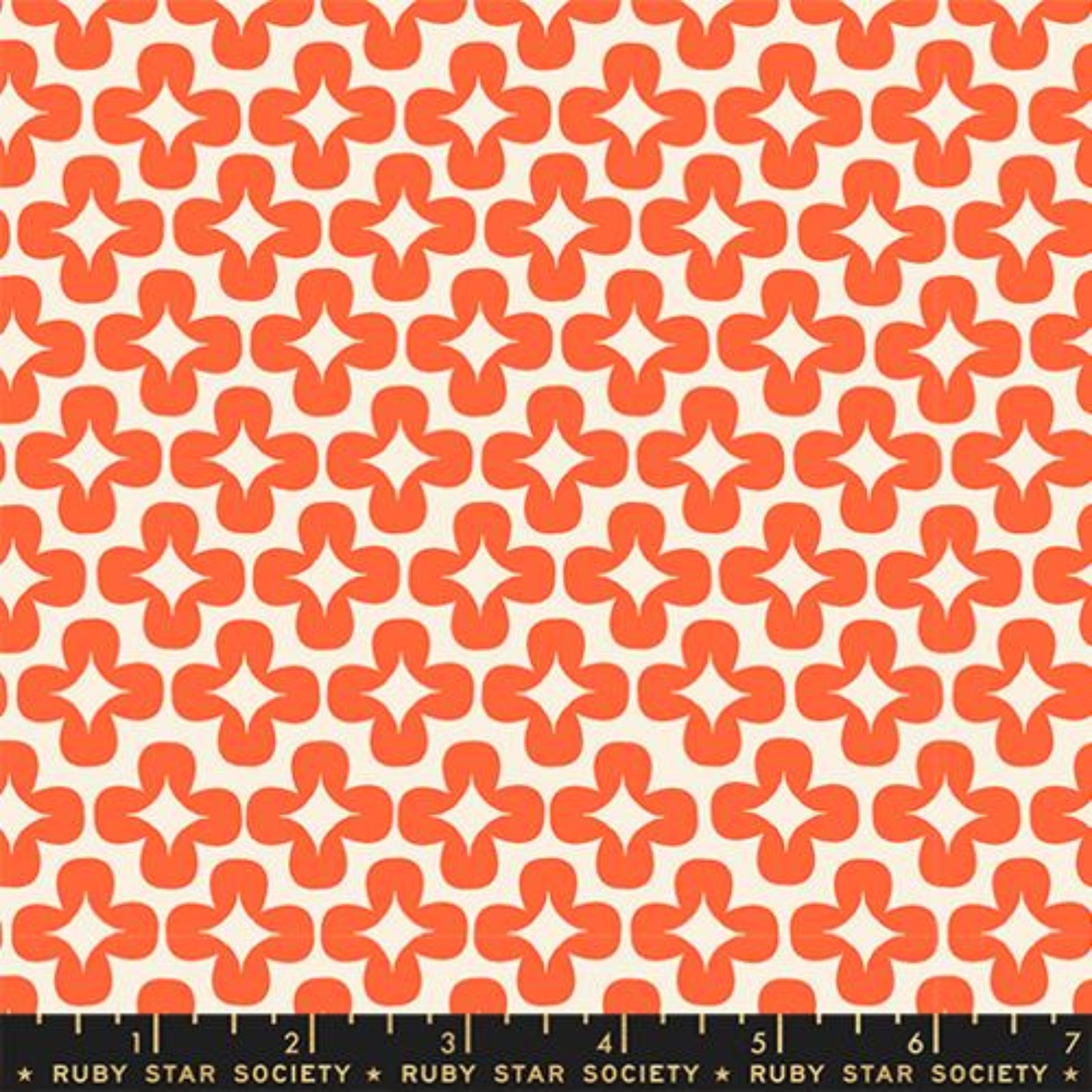 Patterned fabric with orange geometric design on a white background, Ruby Star Society label at the bottom.