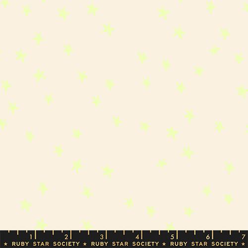 Fabric swatch with small green star pattern on a beige background, labeled Ruby Star Society.