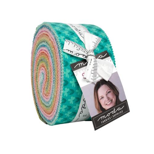 Colorful fabric roll with Moda label on a white background