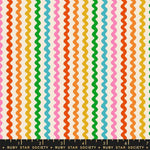 Colorful wavy pattern fabric swatch with a ruler at the bottom