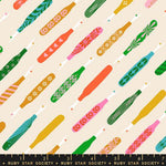Pattern of colorful seam rippers on a beige background with Ruby Star Society label.