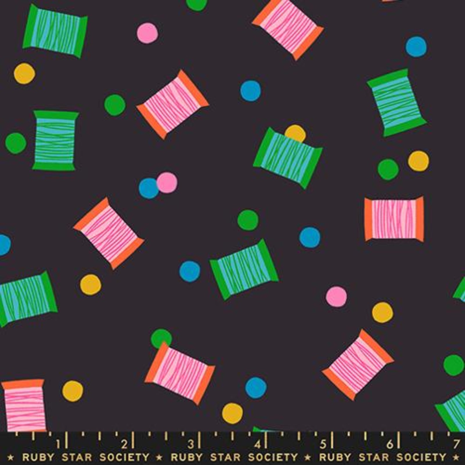 Colorful thread spools and polka dots pattern on a black background with Ruby Star Society label.