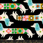 Patterned fabric with dogs and colorful geometric shapes on a black background, featuring Ruby Star Society branding.