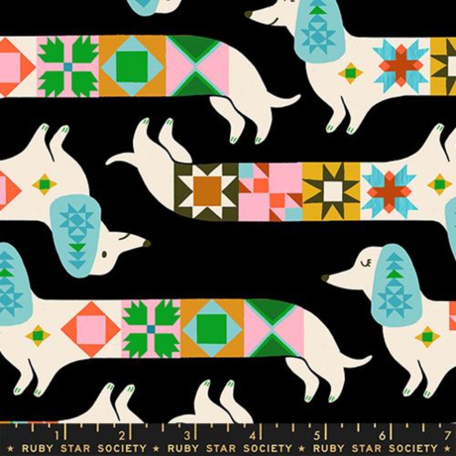 Patterned fabric with dogs and colorful geometric shapes on a black background, featuring Ruby Star Society branding.