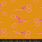 Pattern of pink stork scissors on a mustard yellow background with Ruby Star Society label.