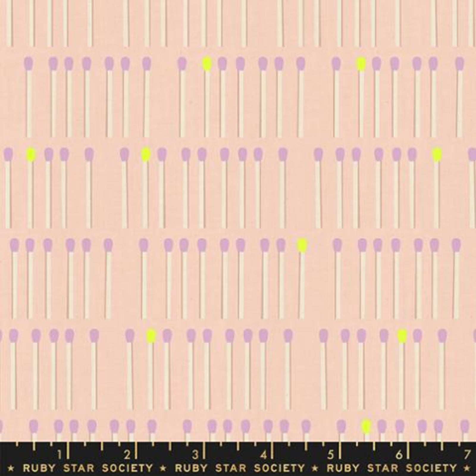 A repeating pattern of matchsticks on a pale peach background, with lavender-purple heads and a few bright yellow-green heads. A black ruler at the bottom shows measurements and the brand name 'RUBY STAR SOCIETY'.