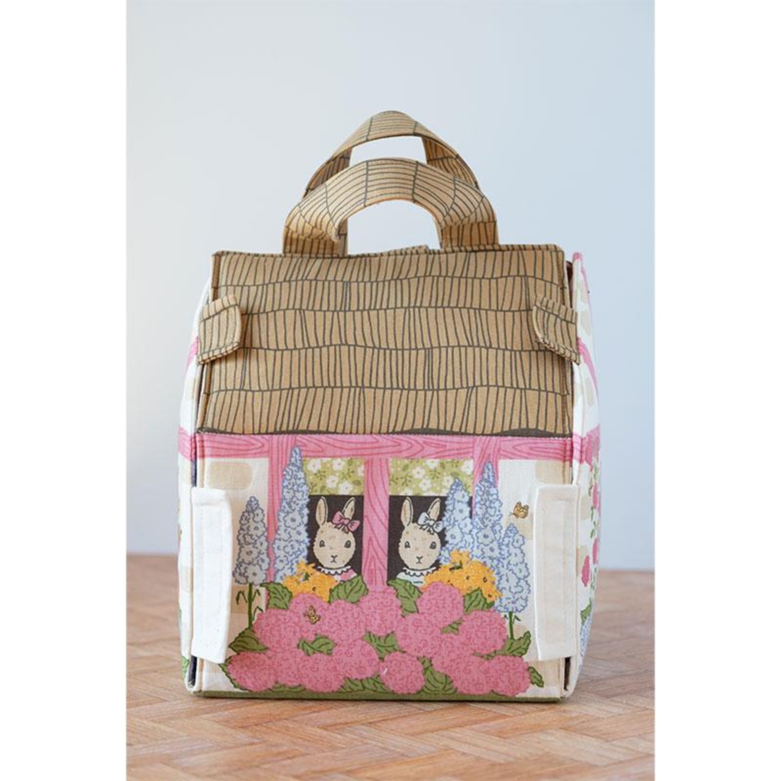 Decorative bag with cartoon characters and floral design