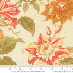 A close-up of a floral fabric print with large orange, red, and cream flowers and olive green leaves on a warm beige background, with a ruler along the bottom edge showing measurements and Modra branding.