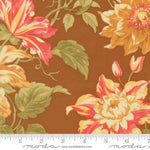 Floral fabric pattern with a ruler for scale on a brown background