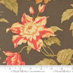 Floral fabric pattern with a ruler for scale on a brown background