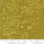 Fabric with a green leaf pattern and Moda label at the bottom.
