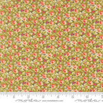 A close-up of a fabric pattern featuring a dense floral print with small pink and red flowers, green leaves, and cream backgrounds, with a measuring ruler along the bottom edge showing the scale.