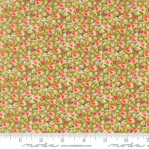 A close-up of a fabric pattern featuring a dense floral print with small pink and red flowers, green leaves, and cream backgrounds, with a measuring ruler along the bottom edge showing the scale.