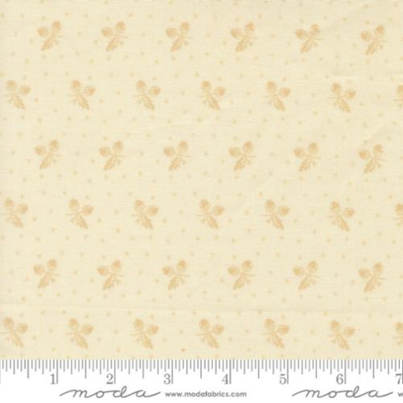 A close-up of a fabric pattern featuring small tan butterfly motifs and tiny gold dots on a warm cream background, with a ruler along the bottom edge showing measurements.