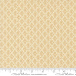 A close-up of a fabric pattern swatch showing a repeating beige and cream damask-style motif, with a ruler along the bottom edge for scale. The Moda Fabrics watermark is visible at the bottom.