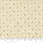 Beige fabric with a repeating geometric diamond lattice pattern in brown, shown with a measuring ruler along the bottom edge.
