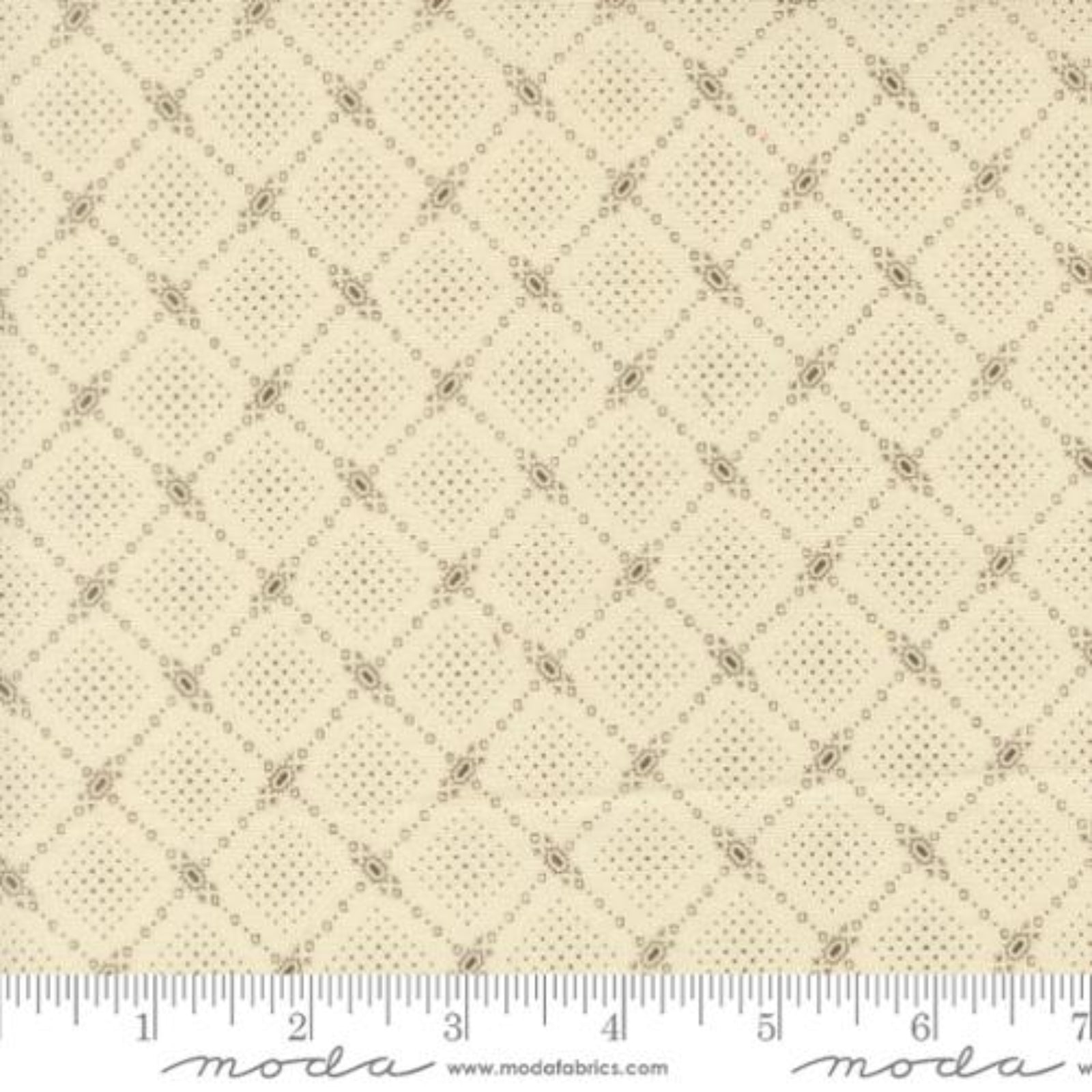 Beige fabric with a repeating geometric diamond lattice pattern in brown, shown with a measuring ruler along the bottom edge.
