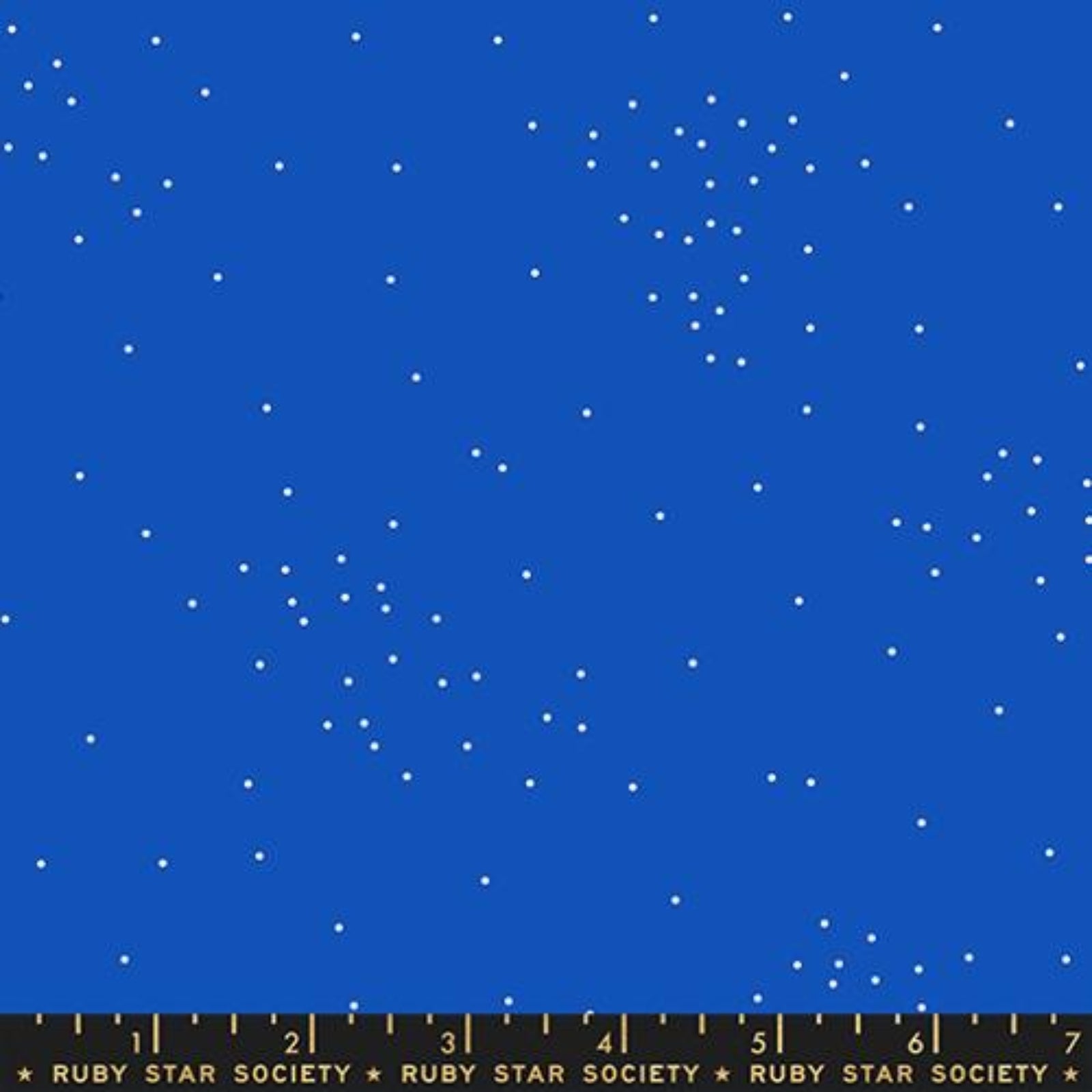 Fabric with white star pattern on a blue background, featuring Ruby Star Society label.
