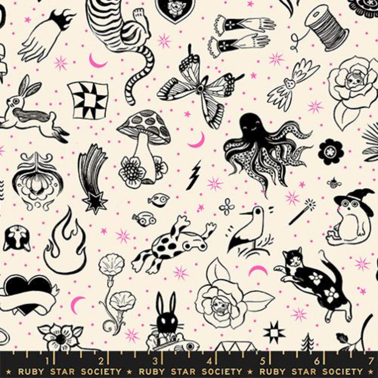 A flat lay of a fabric pattern featuring whimsical black line-art illustrations of fairies, flowers, stars, and nature motifs on a light blue background, with a Ruby Star Society ruler shown along the bottom edge.