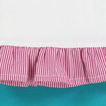 Red and white striped fabric with a ruffled edge on a teal background
