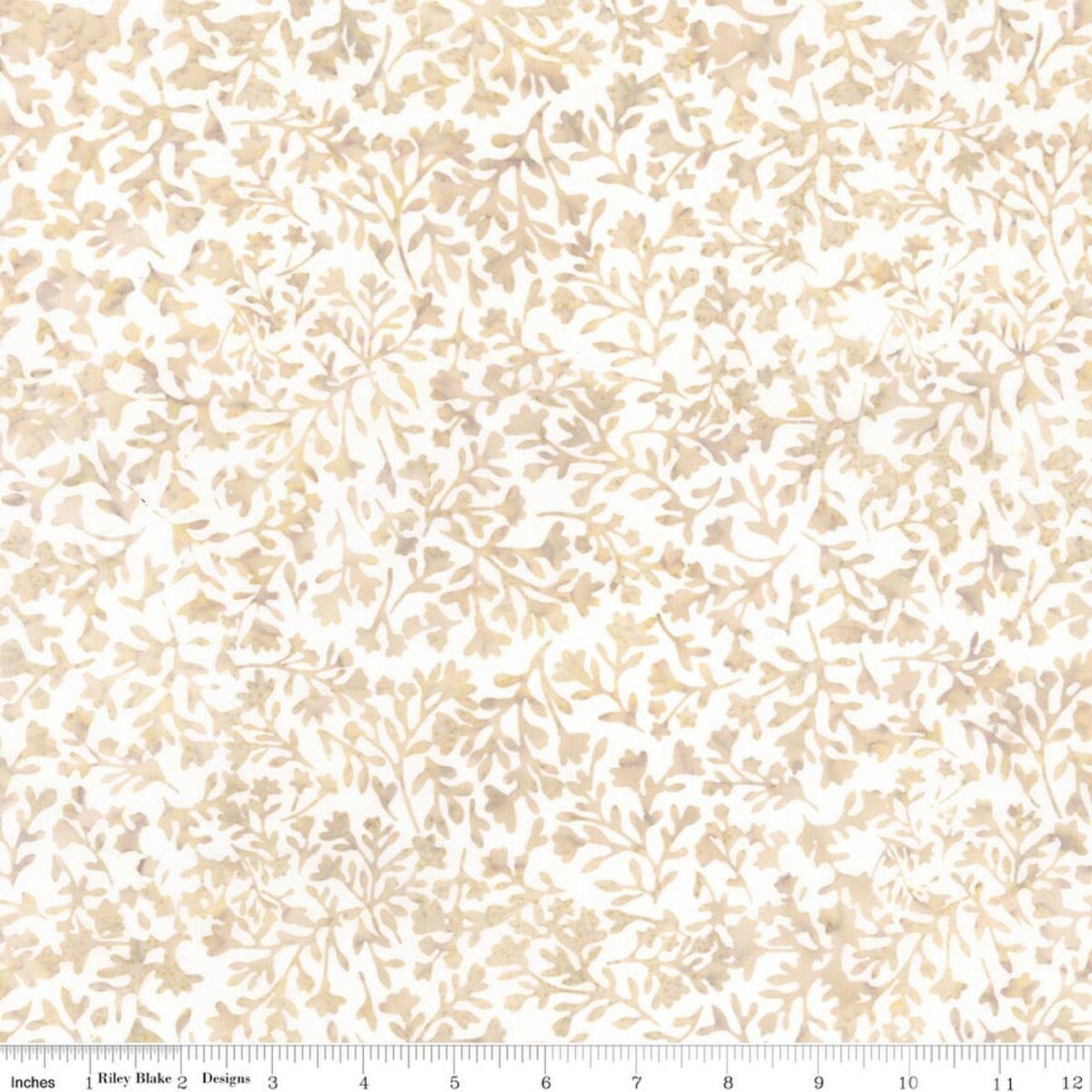 A close-up of a fabric pattern featuring delicate beige and light brown botanical leaf and branch motifs on a white background, with a ruler at the bottom indicating scale.