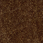 A close-up of a brown and tan camouflage pattern with an organic, leaf-like or bark-like texture filling the entire frame.