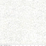 A close-up of a fabric pattern with a delicate, repeating leafy vine design in soft gray and off-white tones. A ruler scale is visible along the bottom edge.
