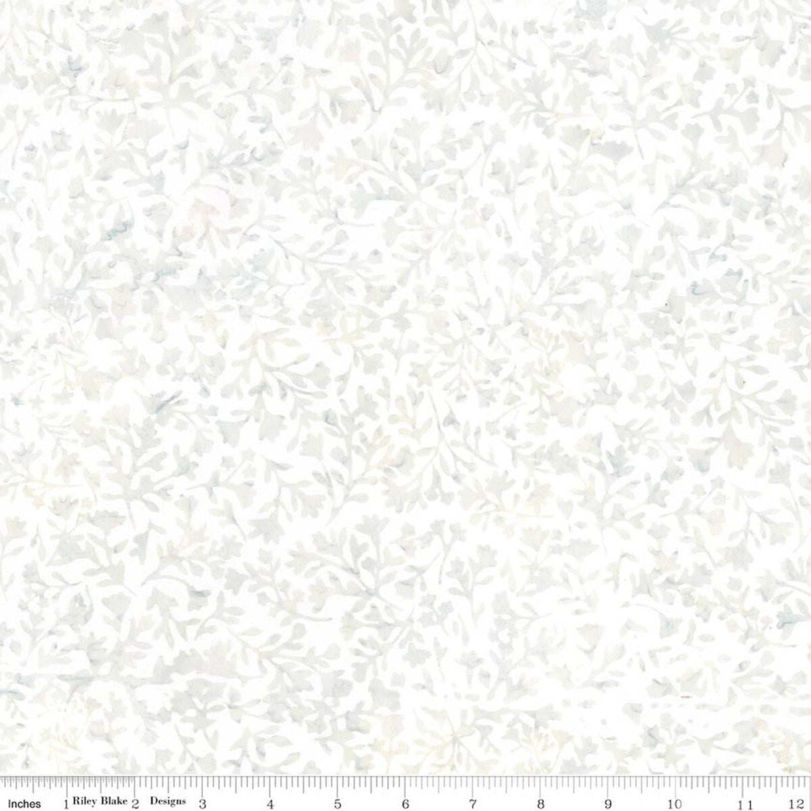 A close-up of a fabric pattern with a delicate, repeating leafy vine design in soft gray and off-white tones. A ruler scale is visible along the bottom edge.