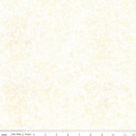 A close-up of a fabric pattern featuring a delicate, repeating damask-style floral and scroll motif in pale yellow on a white background, with a ruler scale visible along the bottom edge.