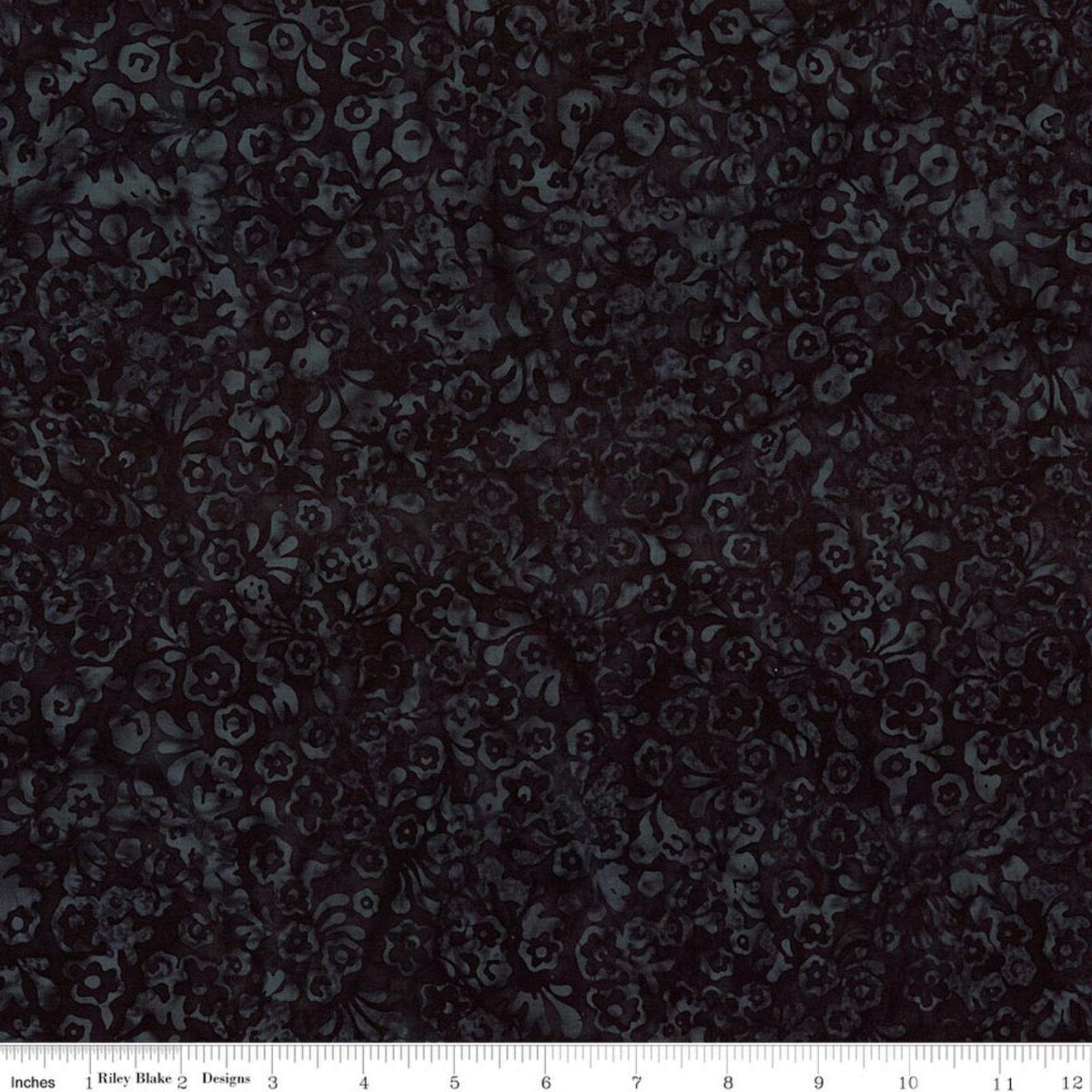 Dark floral patterned fabric with a ruler scale at the bottom showing inches and a brand label reading Riley Blake Boutique.