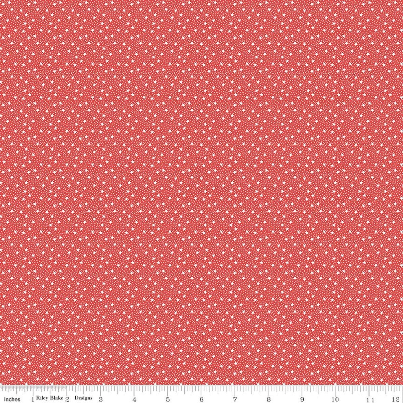 Tiny white stars and dots on a red background
