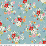 Floral pattern fabric with a ruler at the bottom on a blue background