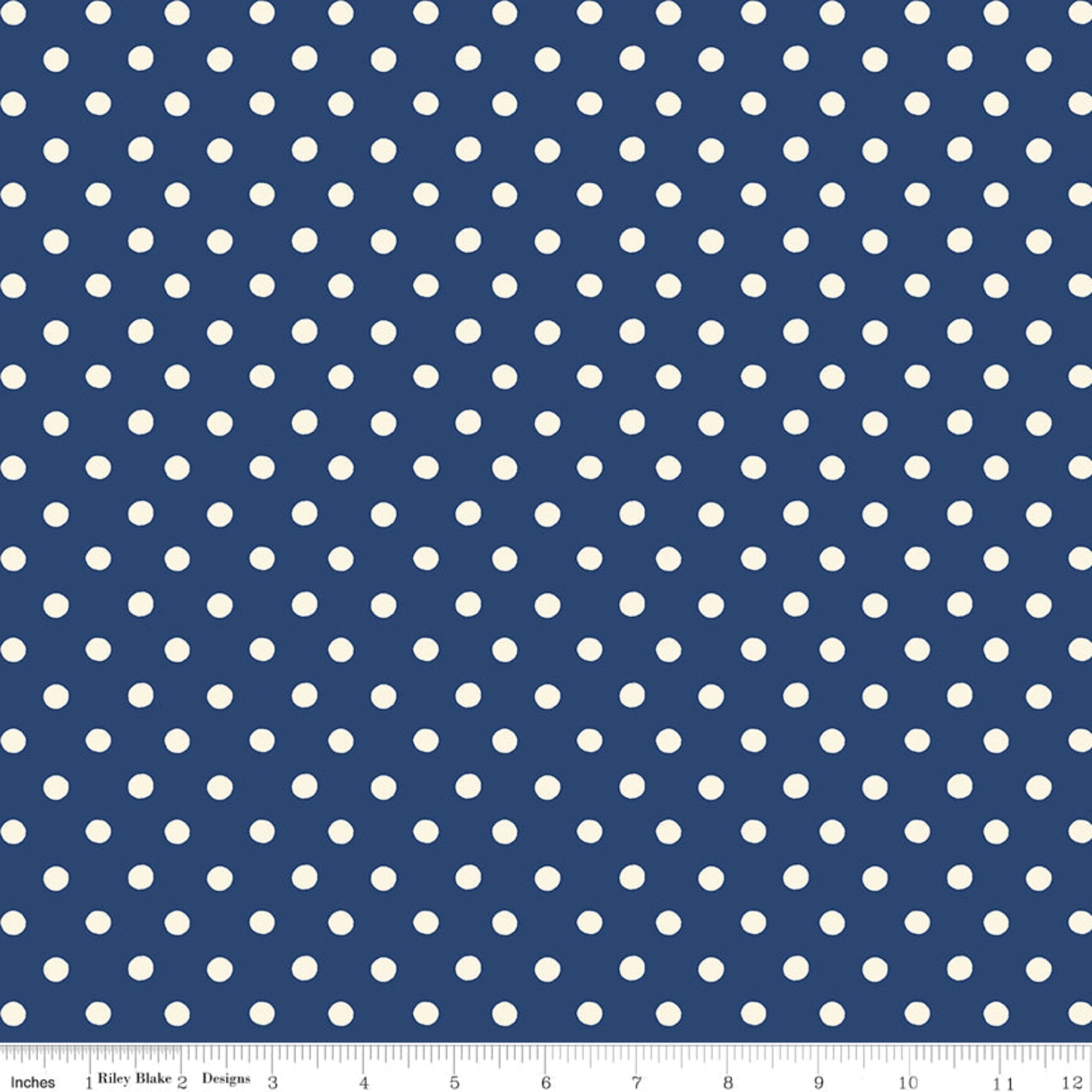 A fabric pattern swatch featuring a repeating white polka dot design on a navy blue background, with a ruler scale visible along the bottom edge.
