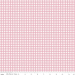 A close-up of a pink and white gingham fabric pattern with a ruler along the bottom edge showing measurements in inches.