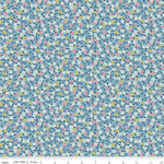 A close-up of a fabric pattern featuring a dense, small-scale floral print on a dusty blue background. The flowers are primarily white with yellow centers and pink accents, interspersed with small dark blue leaves and stems.
