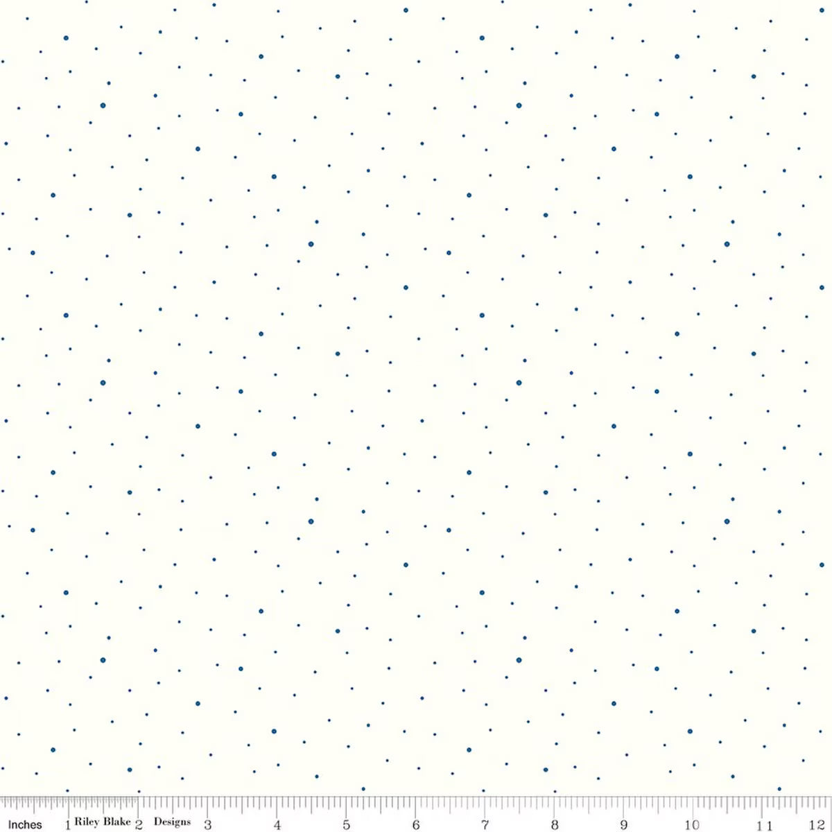 A fabric pattern swatch featuring small, evenly spaced navy blue dots on a warm off-white background, with a ruler visible along the bottom edge.