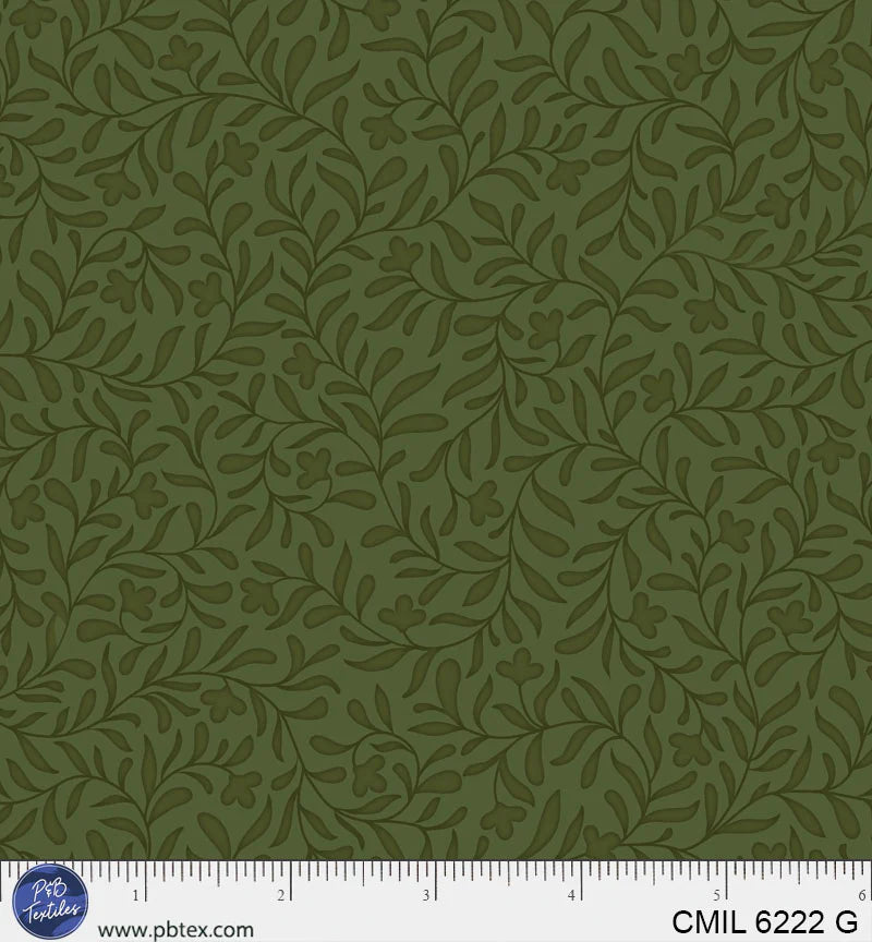 green fabric texture with a ruler at the bottom for scale.